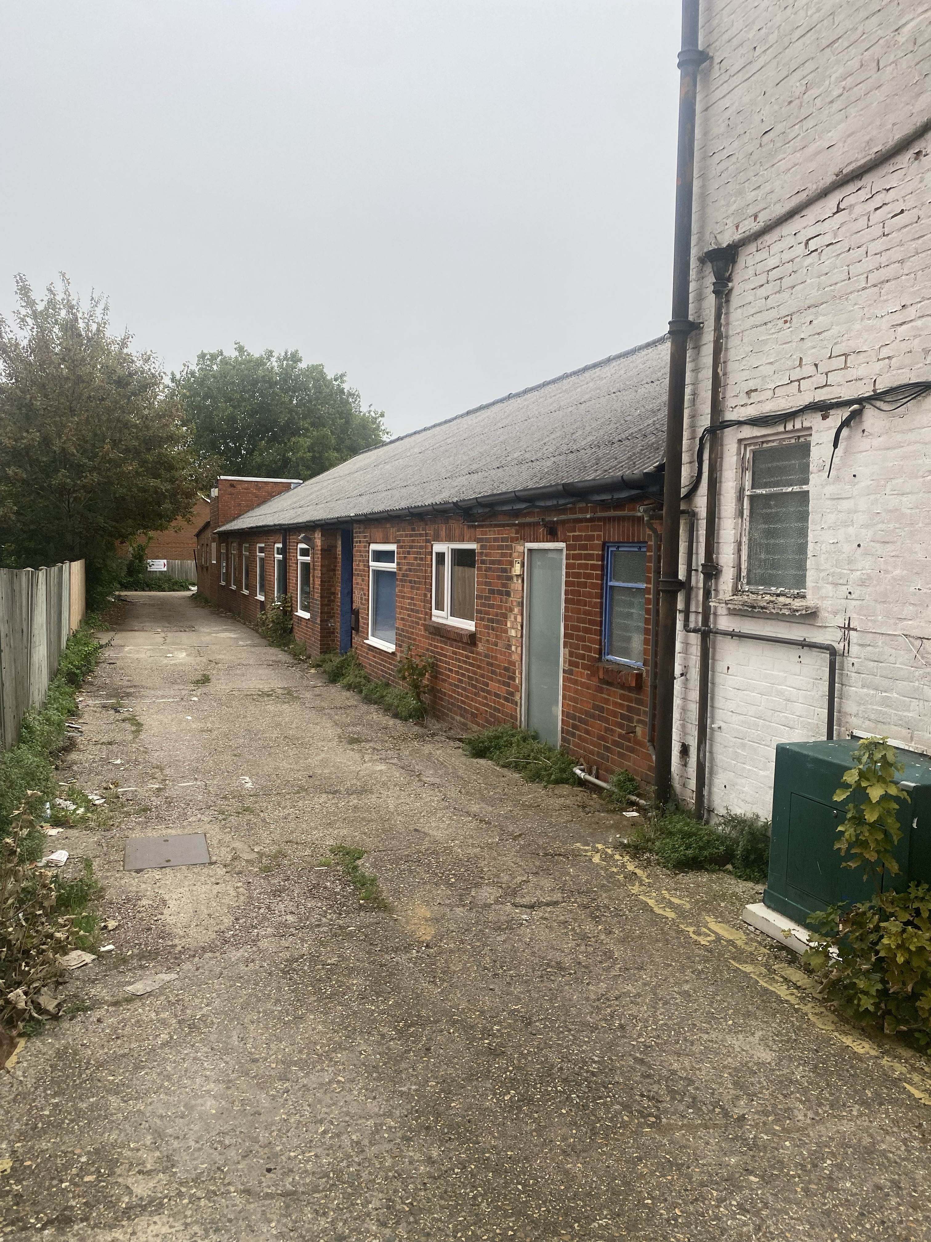 Existing building side access single storey outbuildings