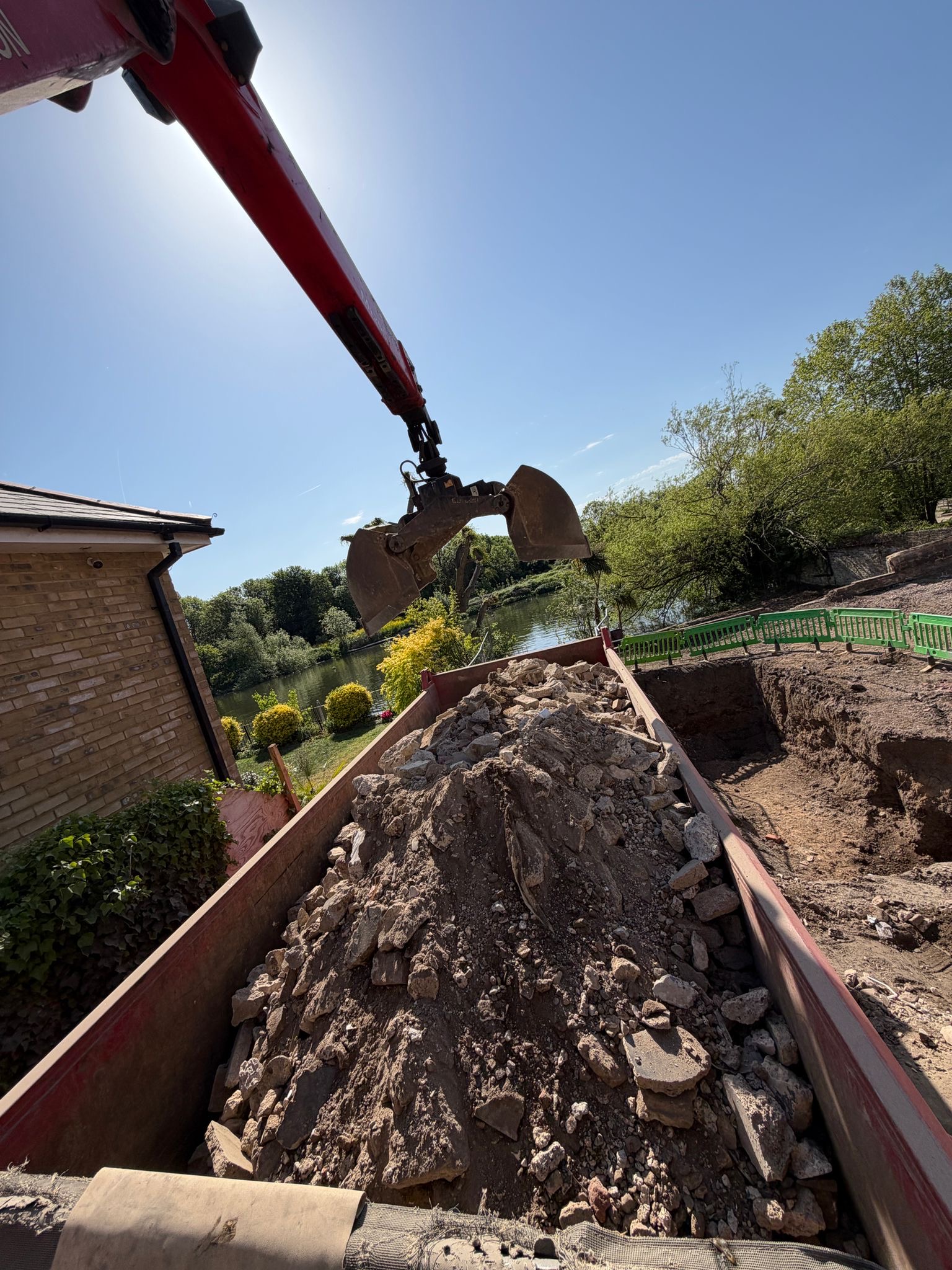 Excavation grab crane spoil removal riverside